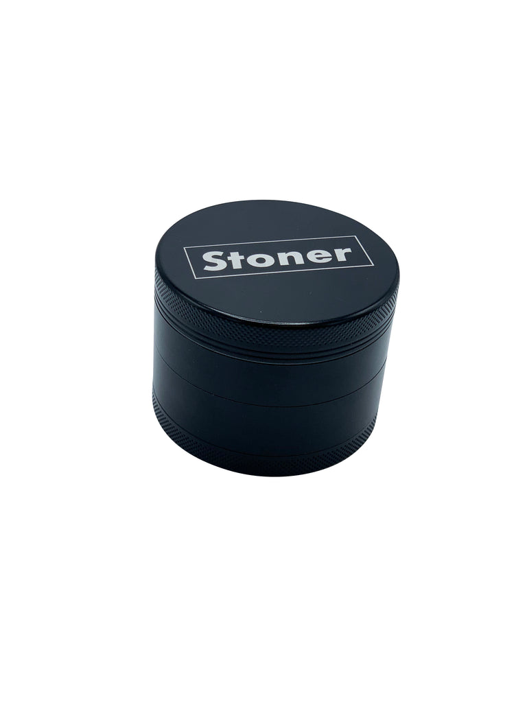 Stoner Grinder with white "STONER" print on top